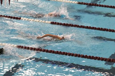 Sophomore Torie Whitbeck swims the 200 Free at 5A Swim Regionals Feb. 5 at Jenks Aquatic Center. Whitbeck earned first place with a time of 2.01. Photo by Kelly Matteson
