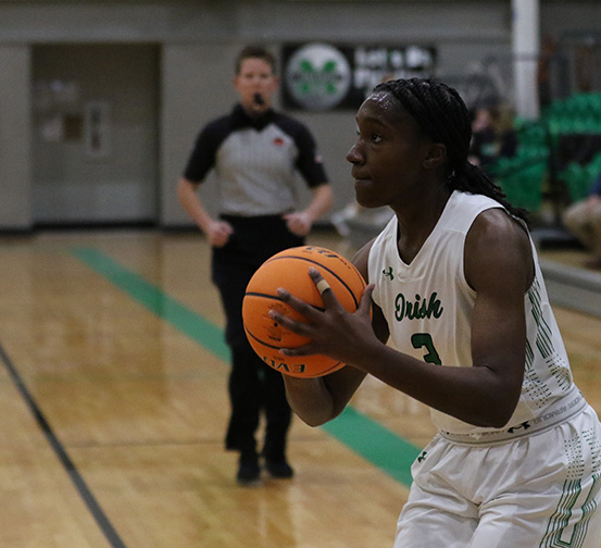 Freshman Victoria Ososanya prepares to shoot during the Jan. 5 varsity game against Del City. The girls won 50-32.
