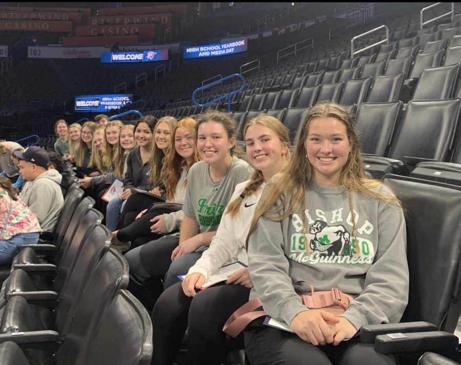 Publications staff poses in Paycom Arena during the Thunder media day.