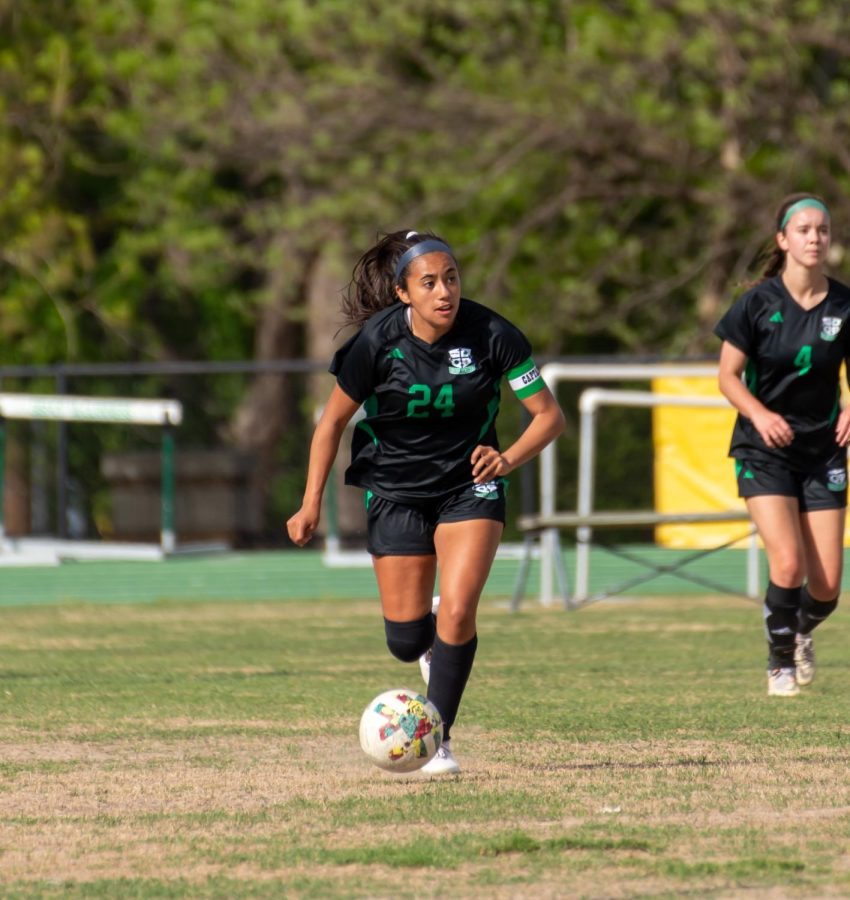 Senior Sabrina Guzman dribbles the ball up the field during the Guymon game. The Irish wins 8-0 