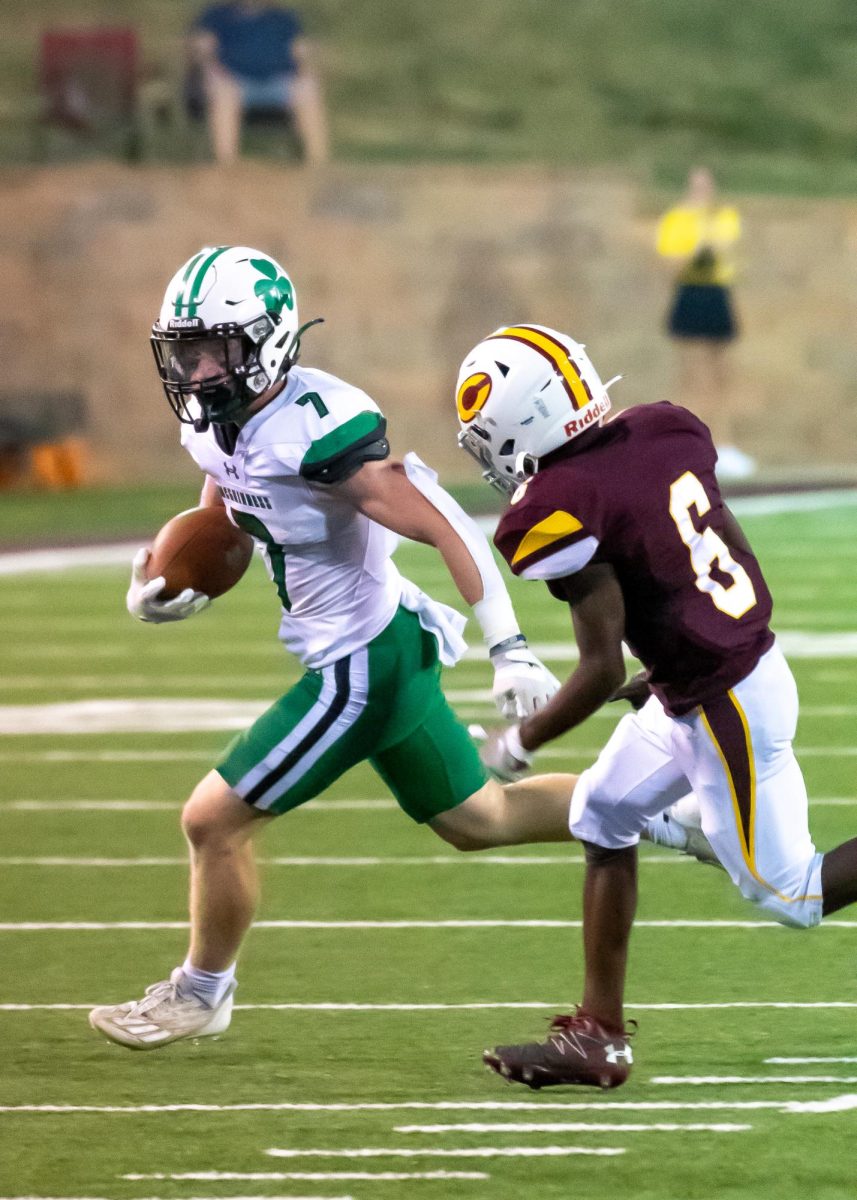 Senior running back JP Spanier playing against Clinton High School on September 1st. Photographed by Lance Payne. 