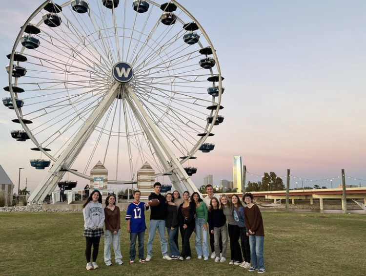 The French exchange students and their hosts pose before they get on the ferris wheel Nov. 7.  “It was really fun to spend time with everyone,” sophomore Emelia Chambers said. Photo by Emelia Chambers. 