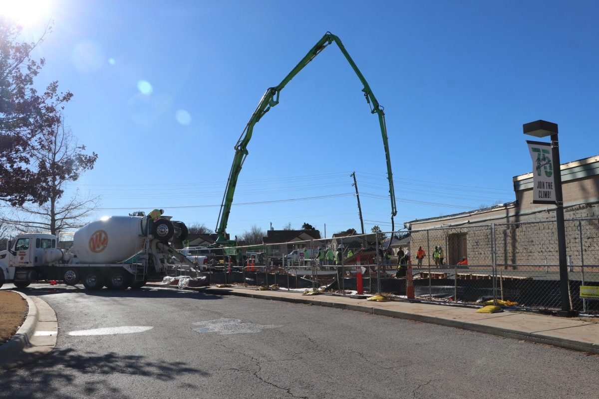 Pump pours concrete slab. The slab is the foundation on which everything else will be built.