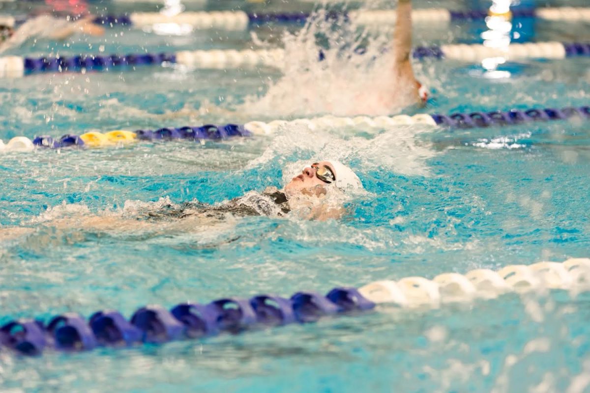 The Jan. 12 meet at Mitch Park, Senior Karen Martinez competes in the 50yd backstroke. She has been on the team for three years.