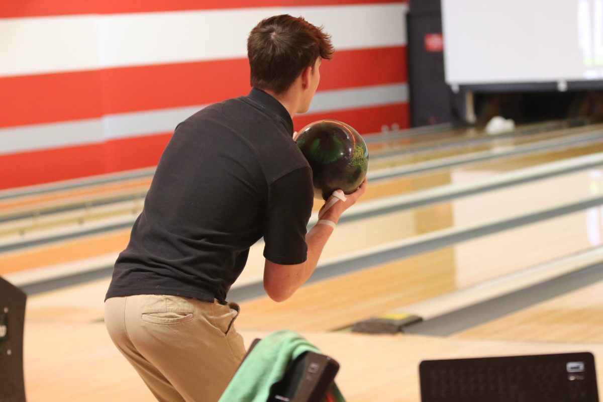 Senior Roman Chambers bowls during practice at Bowlero in Edmond.