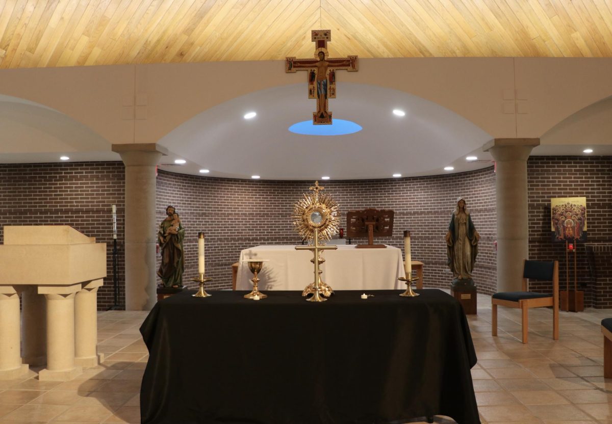 Monstrance sits on altar in chapel.