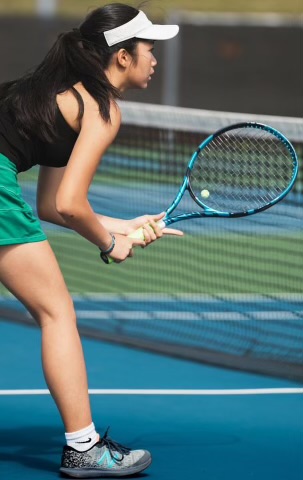 Sophomore Chelsea Le getting ready to return a serve. Photo credits Lance Payne. 