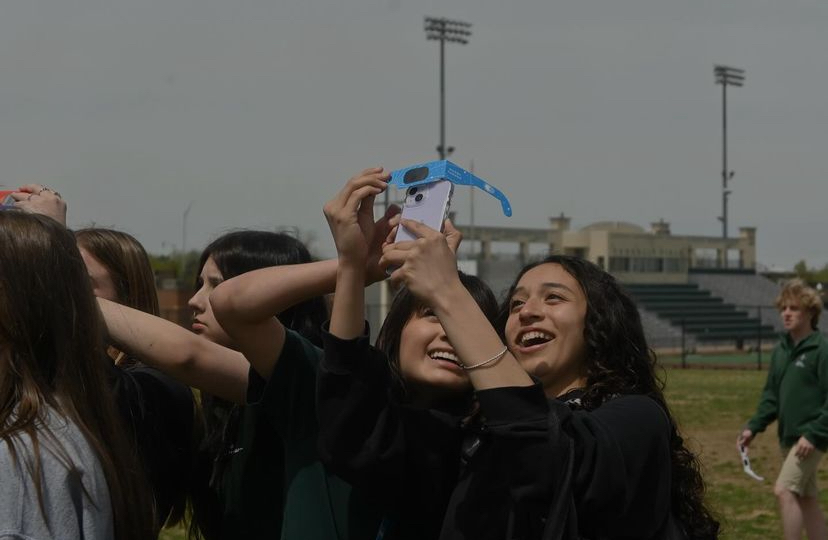 Sophomores Rosemary Bustillo and Vivi Serna pose for a selfie while watching the eclipse. 