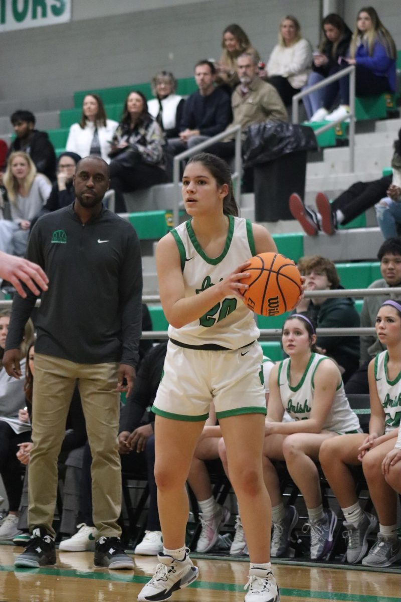 Senior Coffey Collier looks to teammates during Jan. 18 home game against Bishop Lynch.