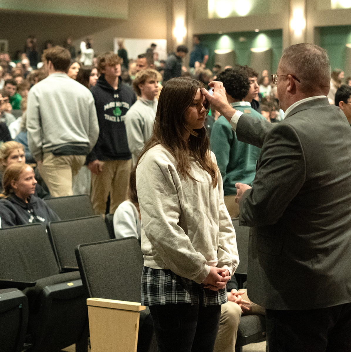 Principal Dr. Andrew Worthington places Ashes on student’s forehead. 