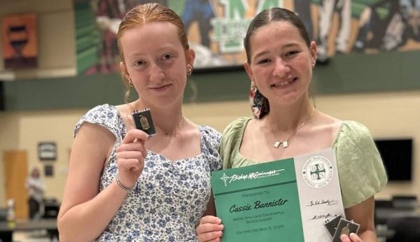 Sophomores Finley Cataldi and Cassie Banister stand for photo after being awarded for their leadership accomplishments.