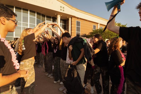Freshman John Paul Terrones is greeted by the senior class on the first day of school. 