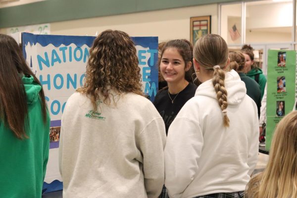 Senior Addie Rischard introduces National Honor Society to students interested in joining the club. 