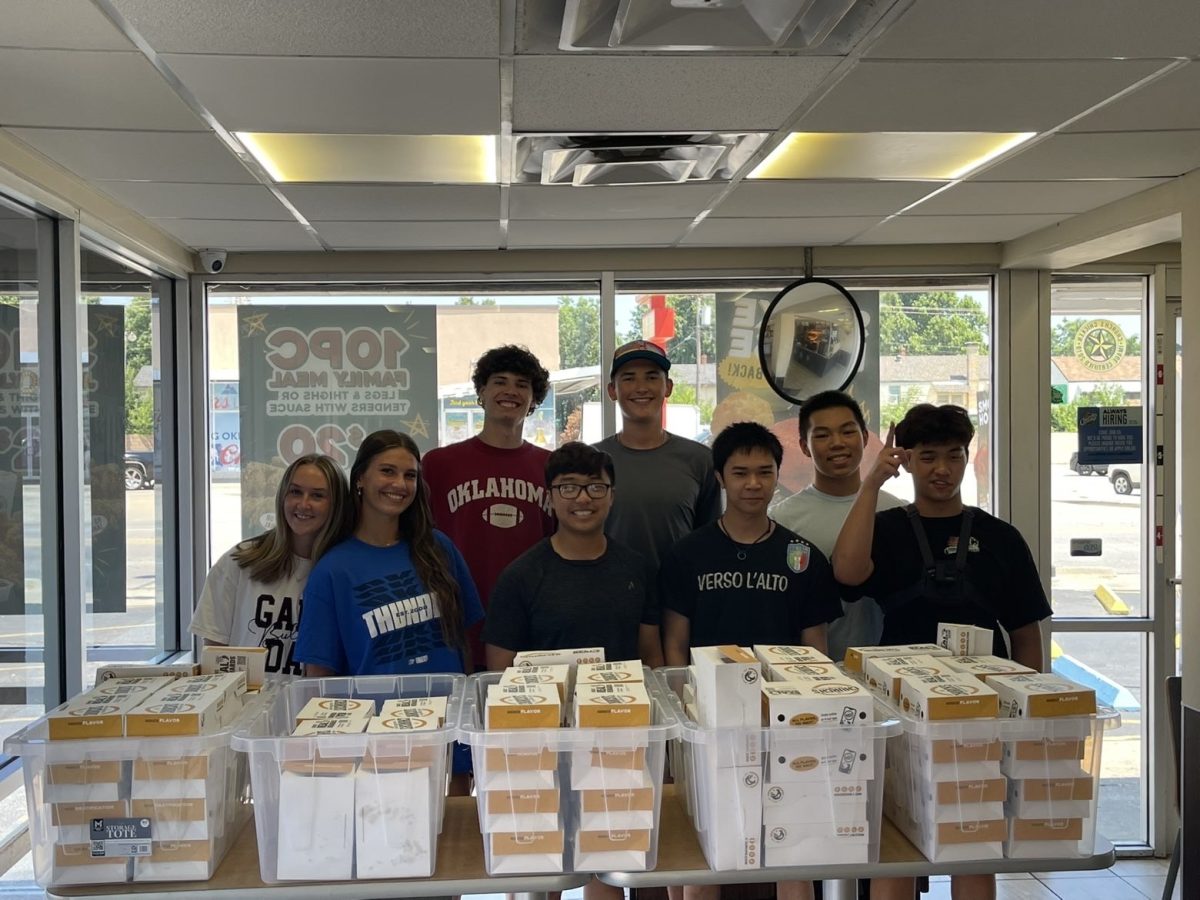 Shows the Hearts and Hunger team preparing care packages to hand out for the homeless. 