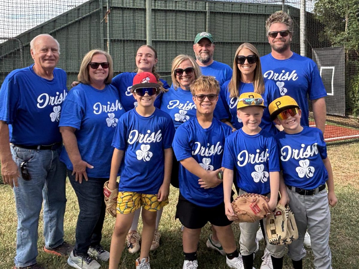 Strike out cancer: sotftball team honors parent's remission
