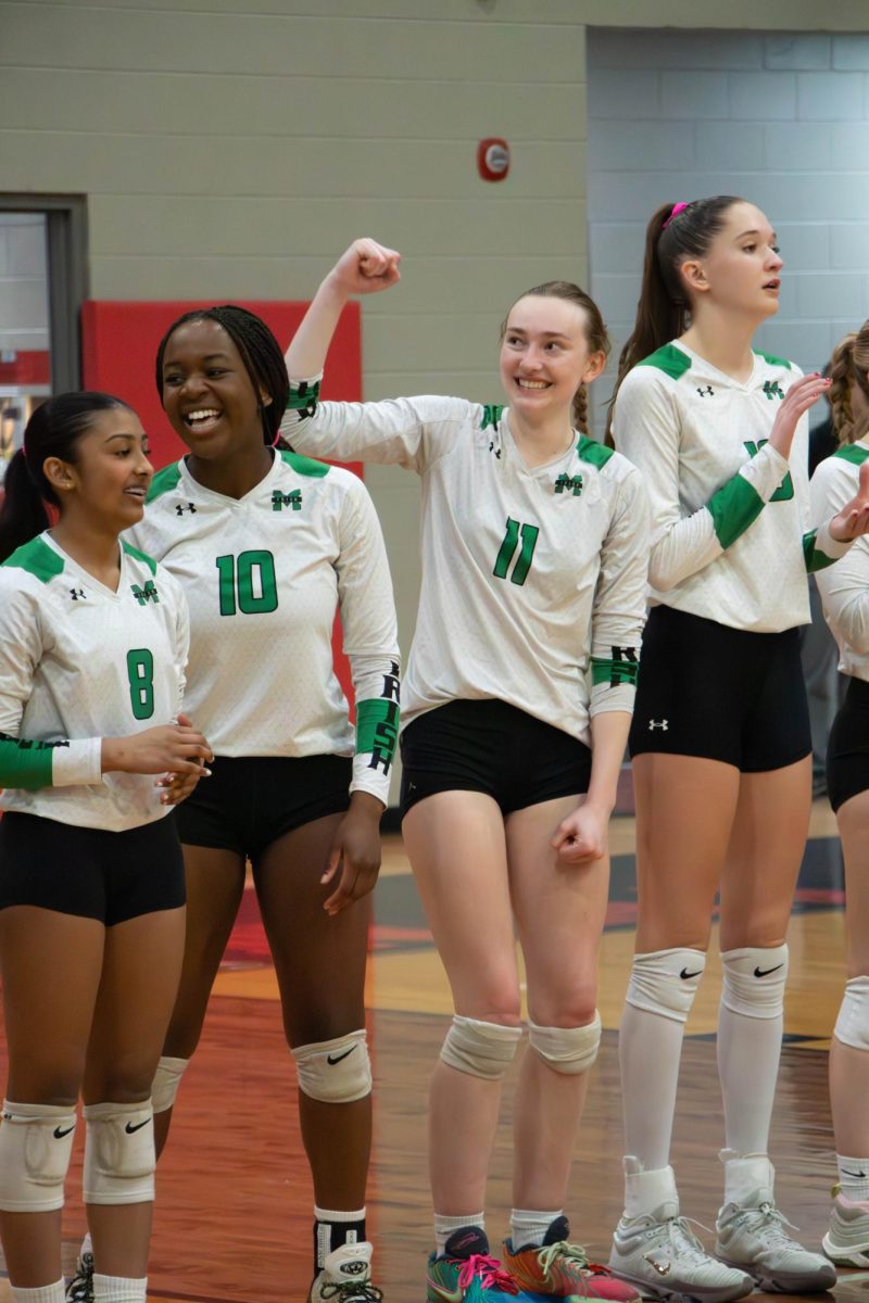The team is excited before receiving their medals