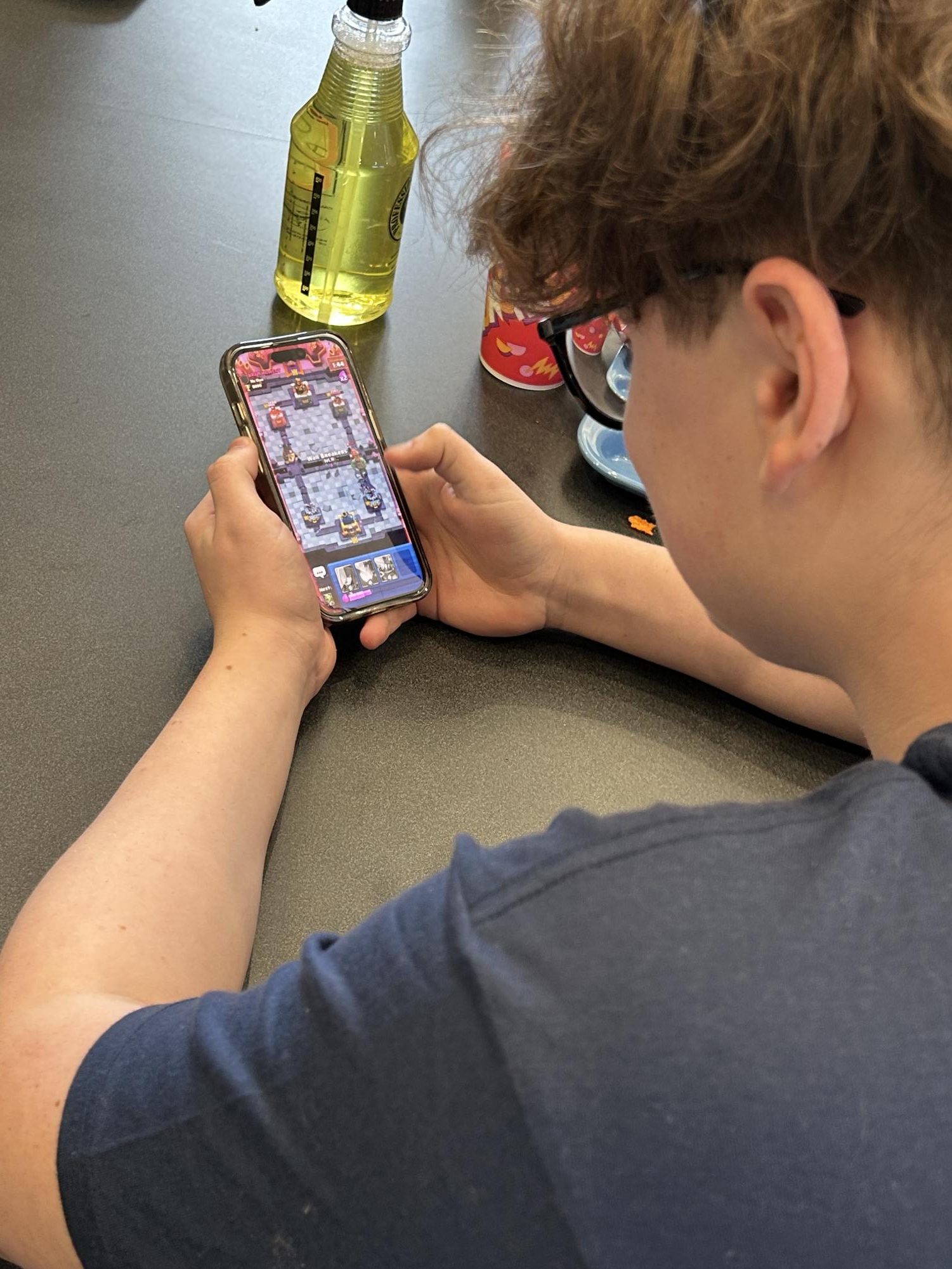 Benites plays Clash Royale during his lunch hour