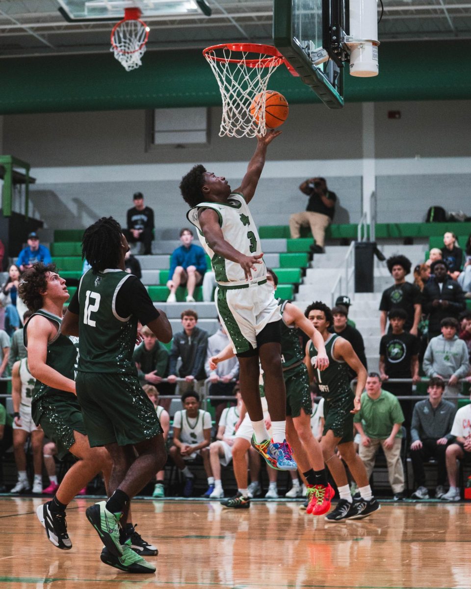 Junior Timothy Ososanya makes a shot in a game against Norman North.