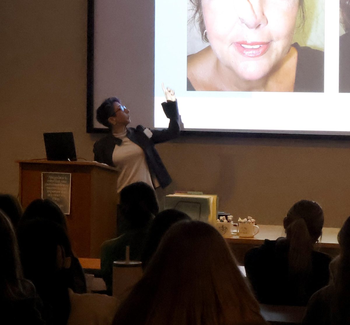 Dr. Anu Bajaj discusses slides from her work as a plastic surgeon. 