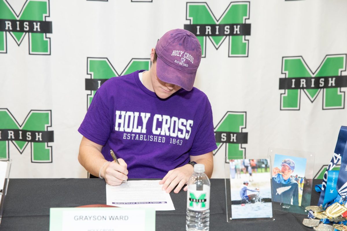 Senior Grayson Ward signs for rowing at Holy Cross. 