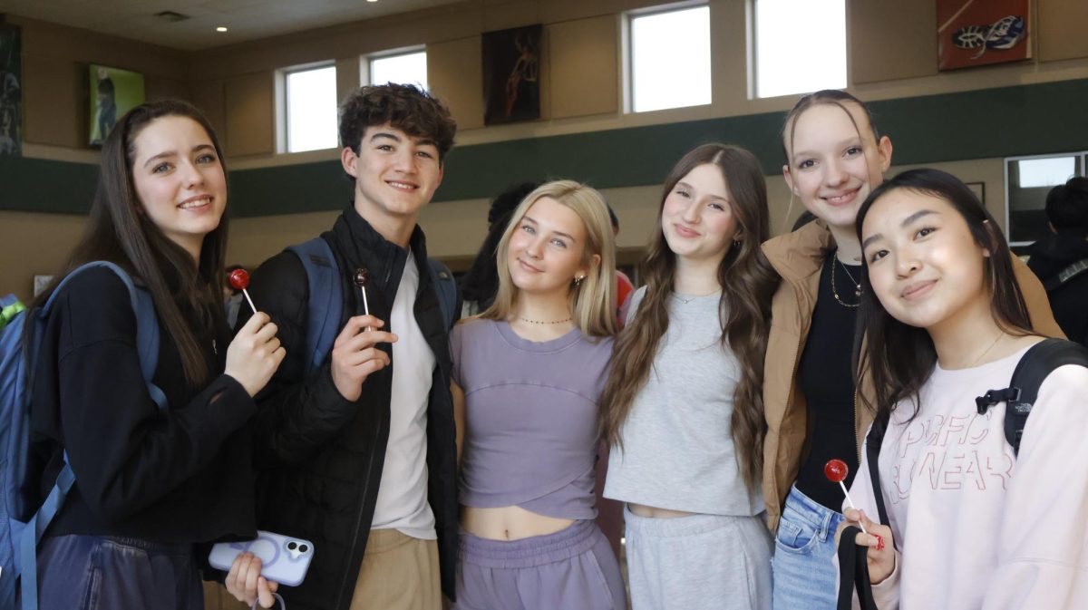 A group of freshmen gather for a photo after receiving  candy in celebration of Catholic Schools Week. 
