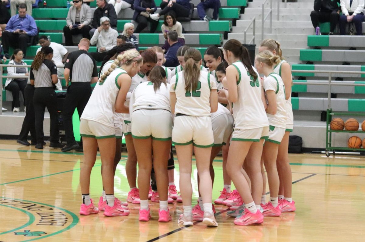 Before the senior night game against Casady, the girls come together to get the energy up. 