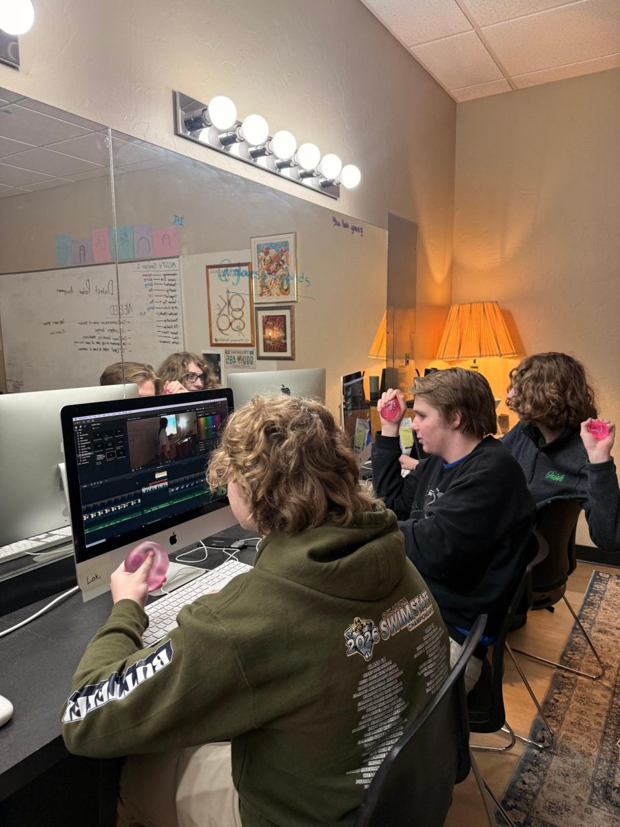 Juniors Jackson Hill, Seth Brown and Andrew Cory edit a broadcast segment. The three students have been hired to film Speech & Debate Nationals in Richmond, Va. next month.